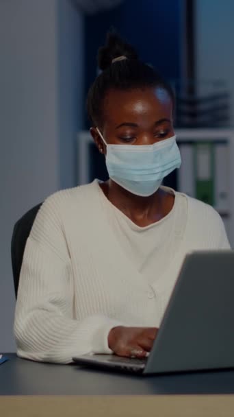 African Woman Face Mask Reading Emails Late Night Respect Deadline — Stock Video