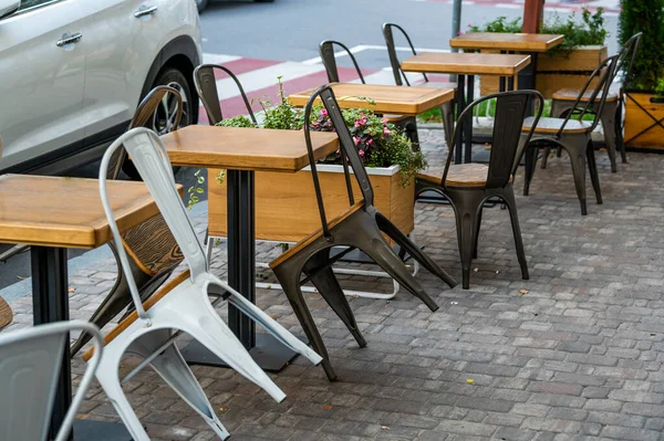 tables and metal chairs, outdoor furniture for cafes and restaurants
