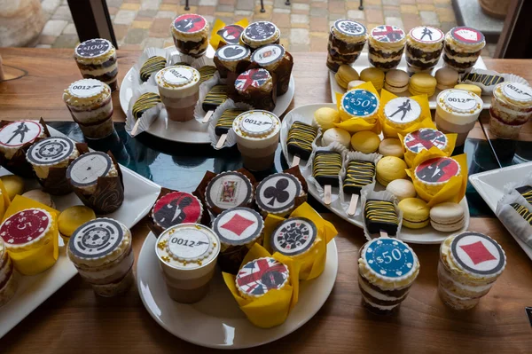 stylized cakes with drawings sweet treats for children's birthday, candy bar on the banquet table