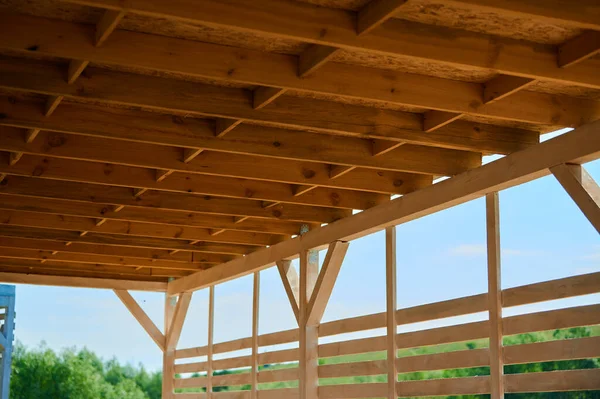 Wooden frame of rafters for the ceiling of the canopy from the sun and rain