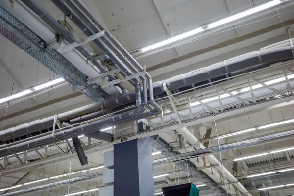 industrial ventilation and air conditioning systems in an industrial room under the ceiling