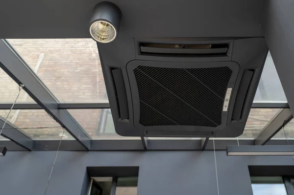 black indoor air conditioner  housing, decoration element in the interior space ventilation system,