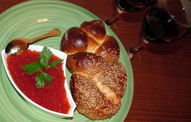Red caviar, challah and two glasses of red wine clipart