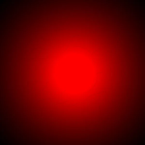 Kırmızı arka plan ile bir spot ışığı orta — Stok fotoğraf
