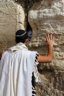 Jewish worshiper pray at the Wailing Wall an important jewish religious site in Jerusalem, Israel.