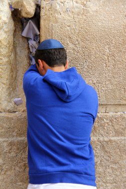 Jewish worshiper pray at the Wailing Wall an important jewish religious site in Jerusalem, Israel. clipart