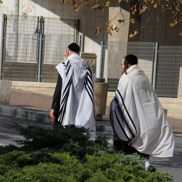 Unidentified religious Jews go from the synagogue
