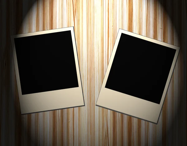 Blank old picture frames on wooden background — Stock Photo, Image