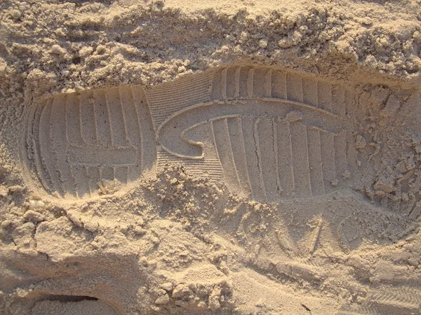 Shoes print imprinted in the sand — Stock Photo, Image