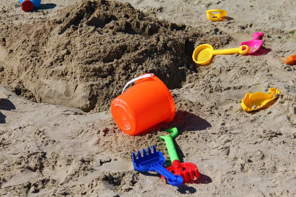 Children's toys on the beach sand — Stock Photo, Image