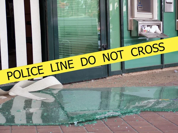 Police line do not cross sign tape on damaged by explosion building background — Stock Photo, Image