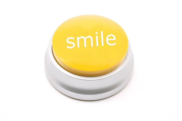 Sorriso grande botão amarelo — Fotografia de Stock