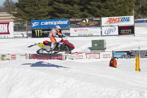 Polaris Red & Black Snowmobile High in the Air Coming down — Stock Photo, Image