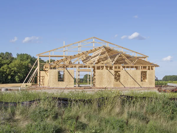 A building framed during construction — Stock Photo, Image