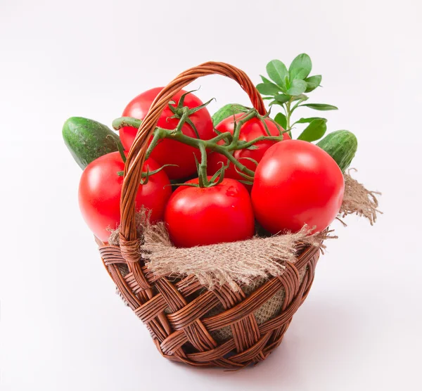 Tomatoes in wattled basket — Stock Photo, Image