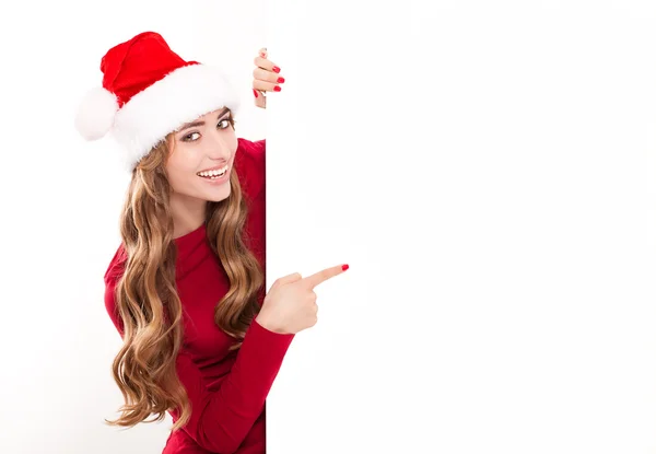 Vrouwelijke santa over een billboard — Stockfoto