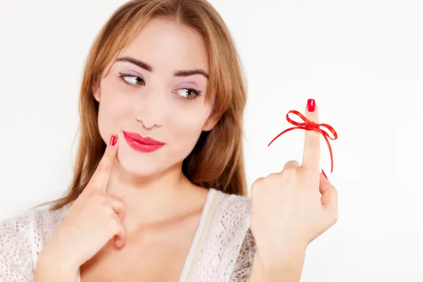 Woman red bow on finger — Stock Photo, Image