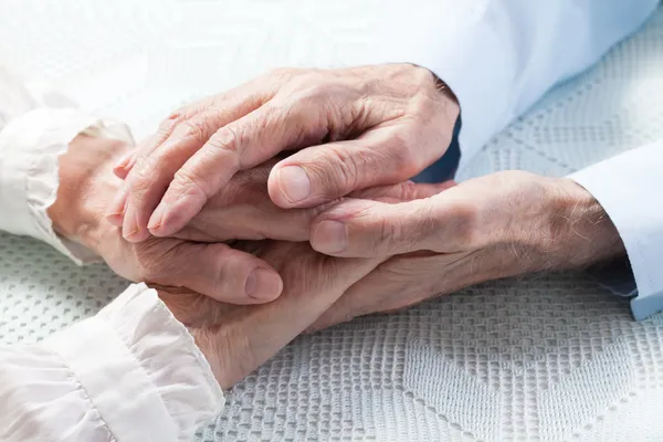 Old hands holding each other — Stock Photo, Image