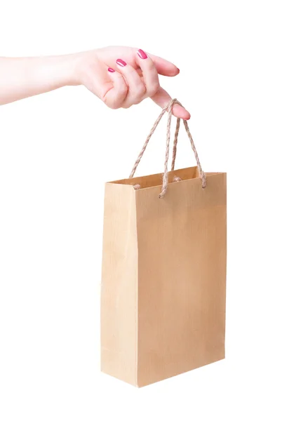 Bolsa de papel en la mano una chica joven . —  Fotos de Stock