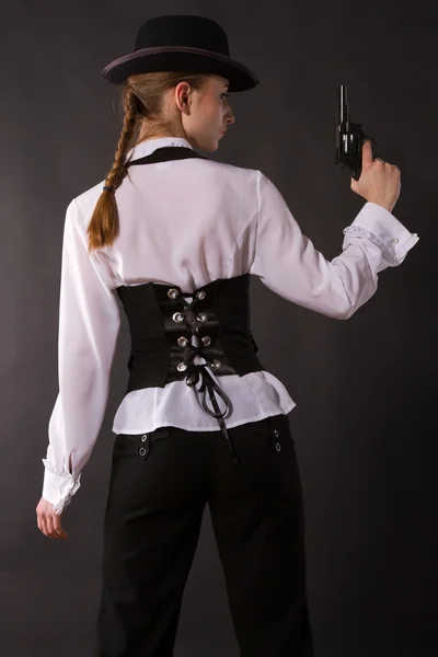 Gangster. Portrait of beautiful young woman with a gun. — Stock Photo, Image