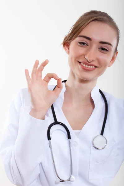 Beautiful woman doctor showing okay — Stock Photo, Image