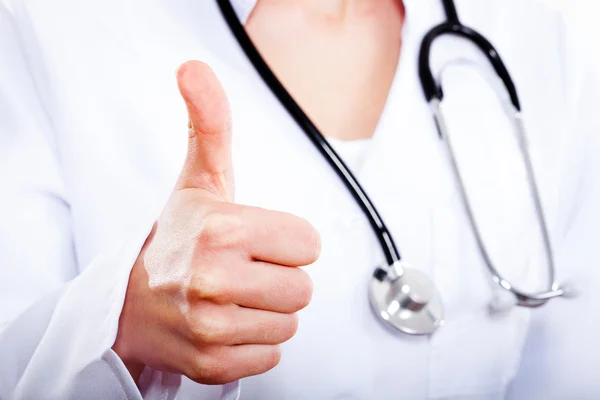 Female doctor with thumbs up gesture. T — Stock Photo, Image