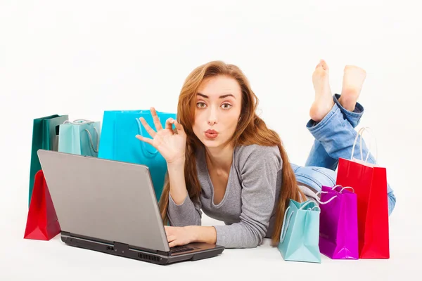 Beautiful young woman shopping over internet — Stock Photo, Image