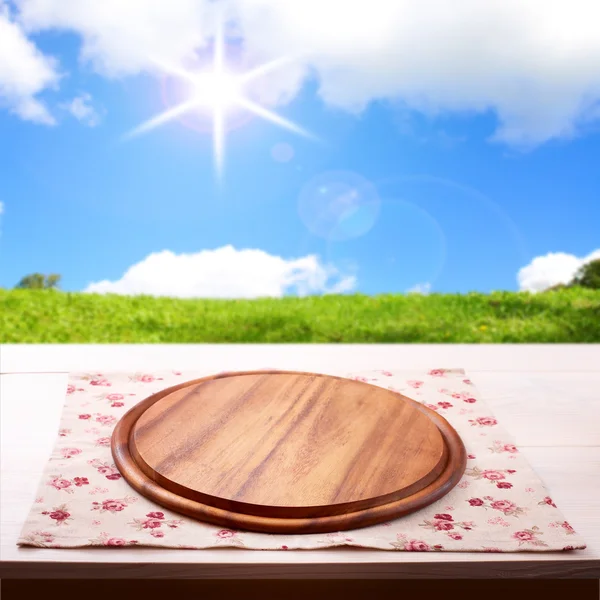 Empty wooden deck table with tablecloth — Stock Photo, Image