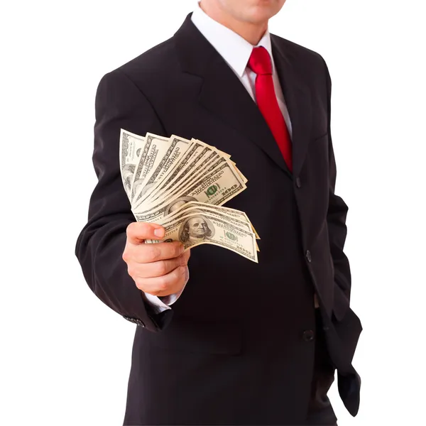 Empresário segurando dólares em dinheiro nas mãos — Fotografia de Stock