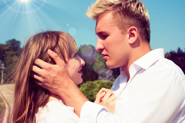 Beautiful girl embraces the guy — Stock Photo, Image