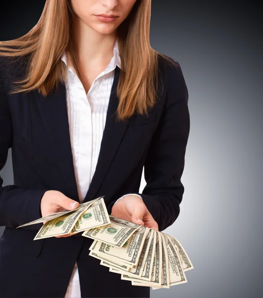Businessman giving cash dollars in the hands — Stock Photo, Image