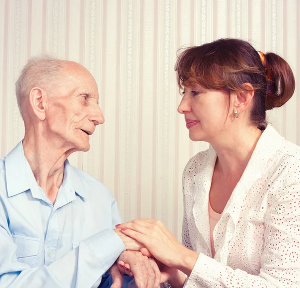 Senior Man, Woman with their Caregiver at Home. — Stock Photo, Image