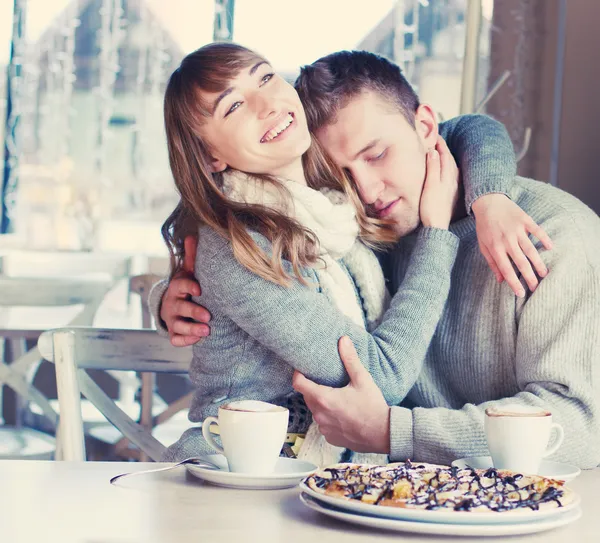 Family is drinking coffee in cafe — Stock Photo, Image