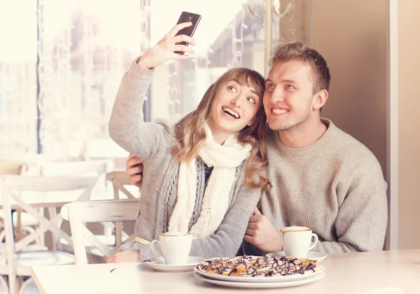 Family is drinking coffee in cafe — Stock Photo, Image