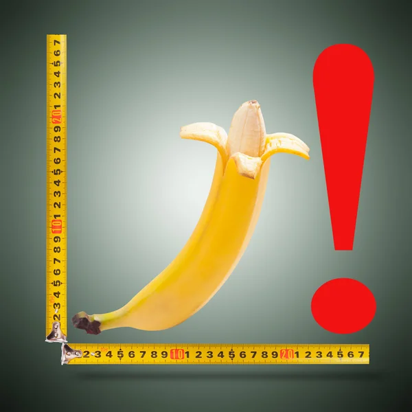 Large banana and measuring tape — Stock Photo, Image