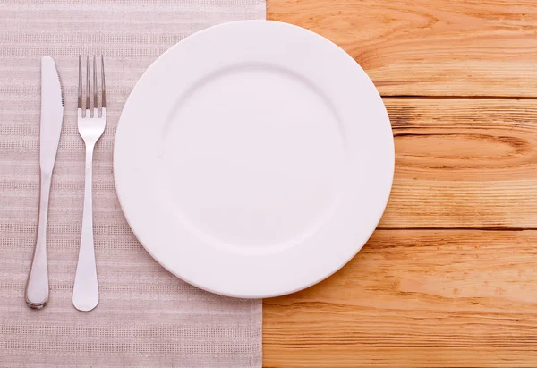 Cutlery red checkered tablecloth tartan on  wooden table top view. — Stock Photo, Image