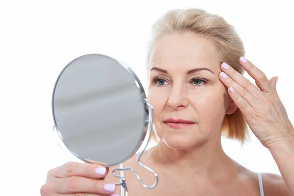 Happy Middle Aged Woman Model Touching Face Skin Looking Mirror — Stock Photo, Image