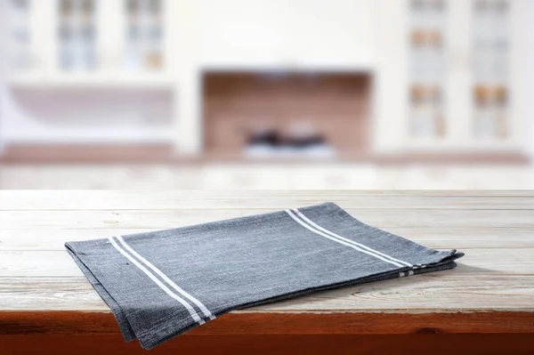 Napkin on wooden desk perspective. Kitchen background selective focus.