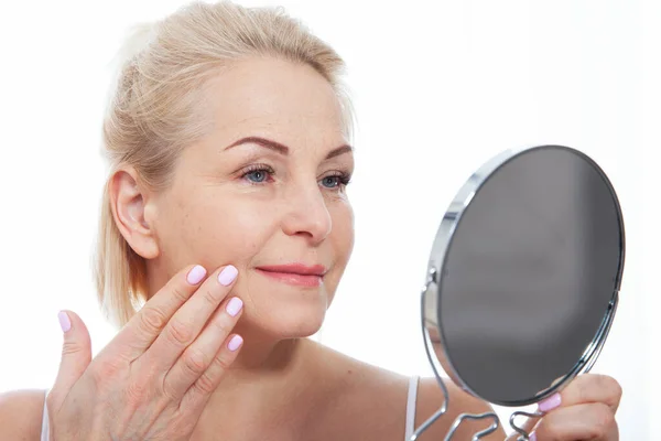 Happy Middle Aged Woman Model Touching Face Skin Looking Mirror — Stock Photo, Image