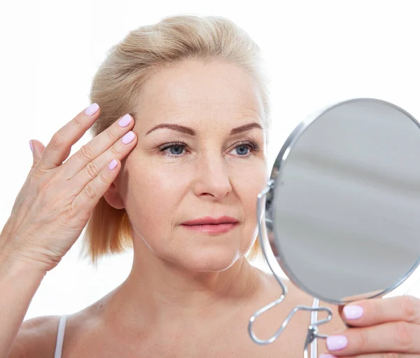 Happy Middle Aged Woman Model Touching Face Skin Looking Mirror — Stock Photo, Image