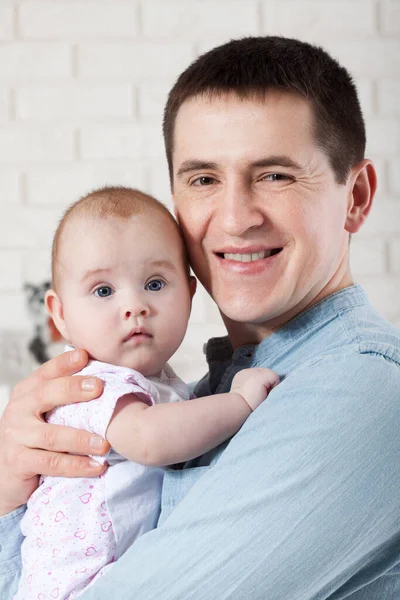 baby with dad. family, parenthood and people concept - father with little baby at home