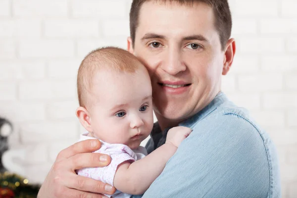 baby with dad. family, parenthood and people concept - father with little baby at home