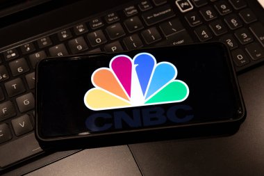 CNBC  logo on smart phone screen , , background is a keyboard  , Sydney Australia July 30 2022
