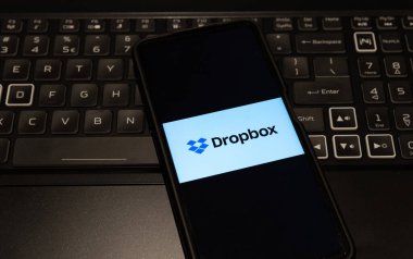 dropbox logo on mobile phone , background is a keyboard  , Sydney Australia July 30 2022
