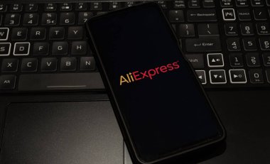 aliexpress logo on mobile phone , background is a keyboard  , Sydney Australia July 30 2022