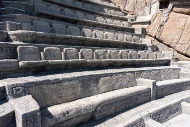 Seats carved into stone at The Minack Outdoor Theatre in Porthcurno in Cornwall uk