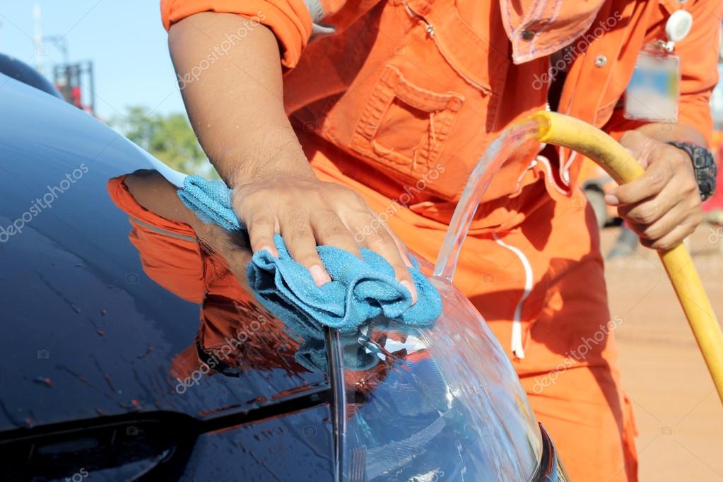 Cleaning black car by hand Stock Photo by ©chatree12 47762565