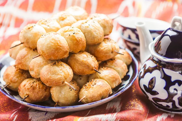 Uzbek national food on traditional fabric — Stock Image Uzbek national food on traditional fabric Royalty Free Stock Photos