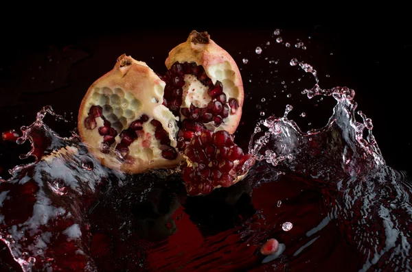 Splash of pomegranate — Stock Photo, Image