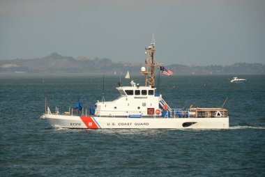US Coast Guard cutter on patrol clipart
